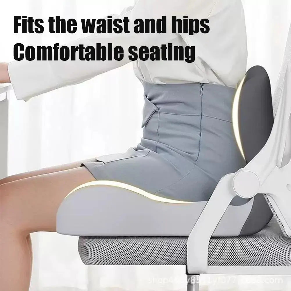 A person is shown sitting comfortably in a gray ergonomic memory foam car seat cushion.