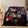 A dark flannel throw blanket featuring a collage of various horror movie characters and monsters.