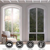 A window with one-way privacy film installed, showing a bright outdoor view.