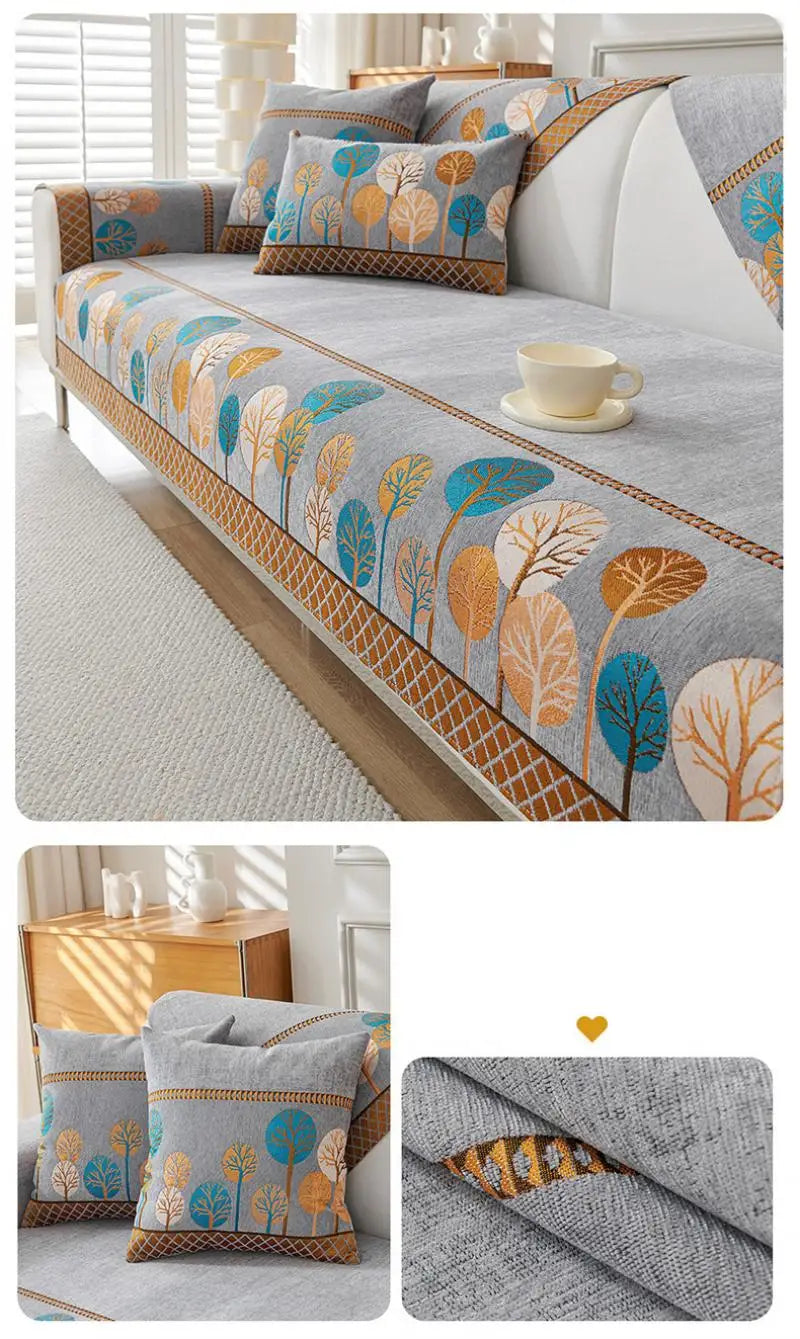A jacquard sofa seat and back cover featuring a floral pattern in shades of blue, orange, and green on a gray fabric.