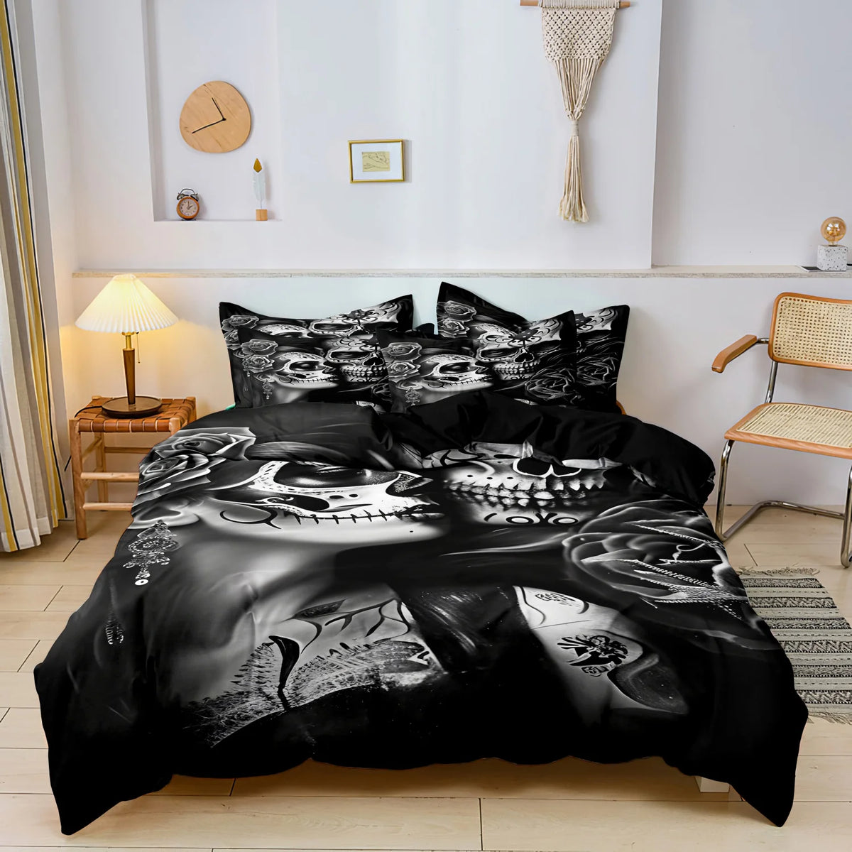 A black duvet cover featuring a detailed monochrome design of sugar skulls and skeletal elements.
