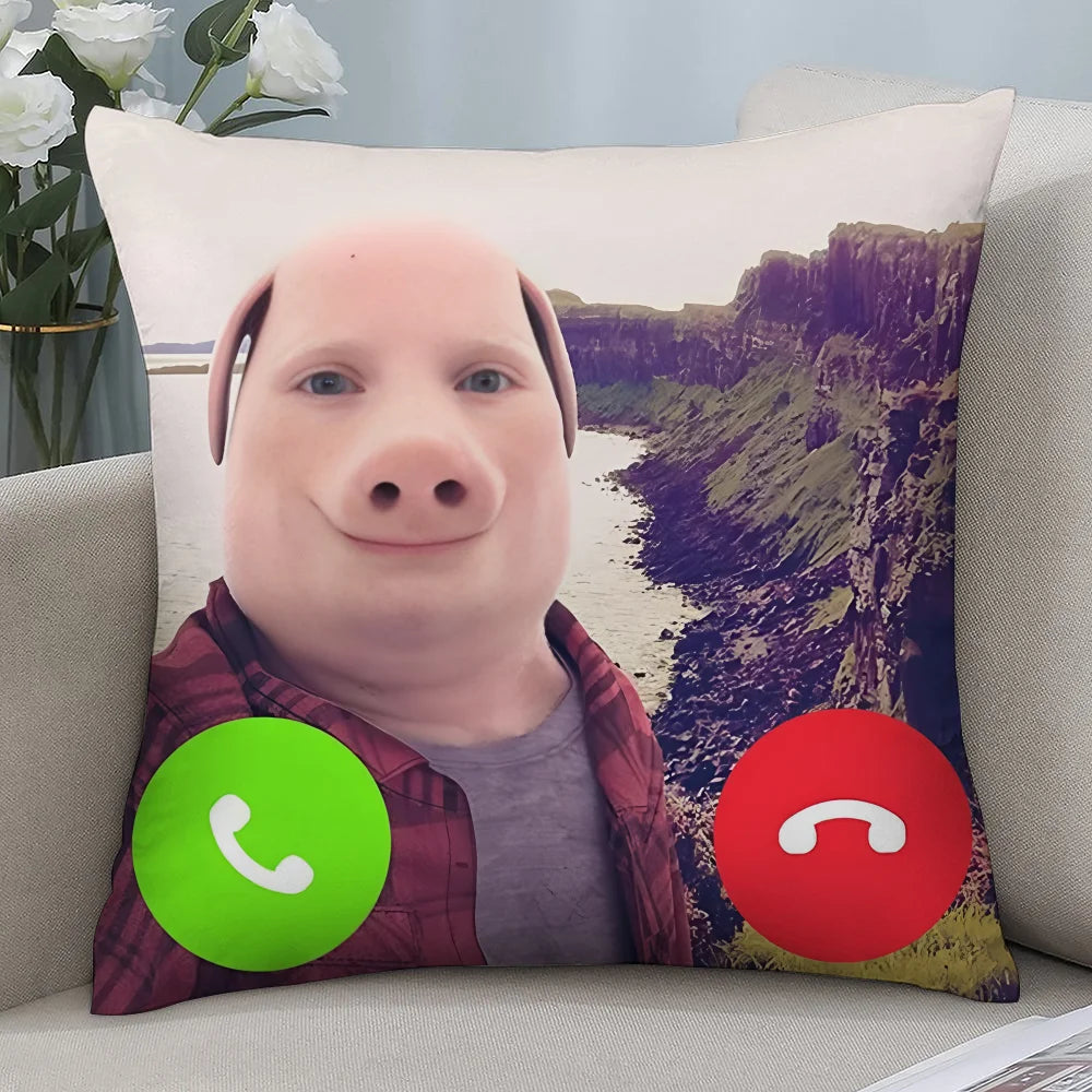 A decorative throw pillow featuring a cartoon pig face against a scenic landscape background.