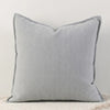 A light gray throw pillow cover with vertical stripes on a white background.
