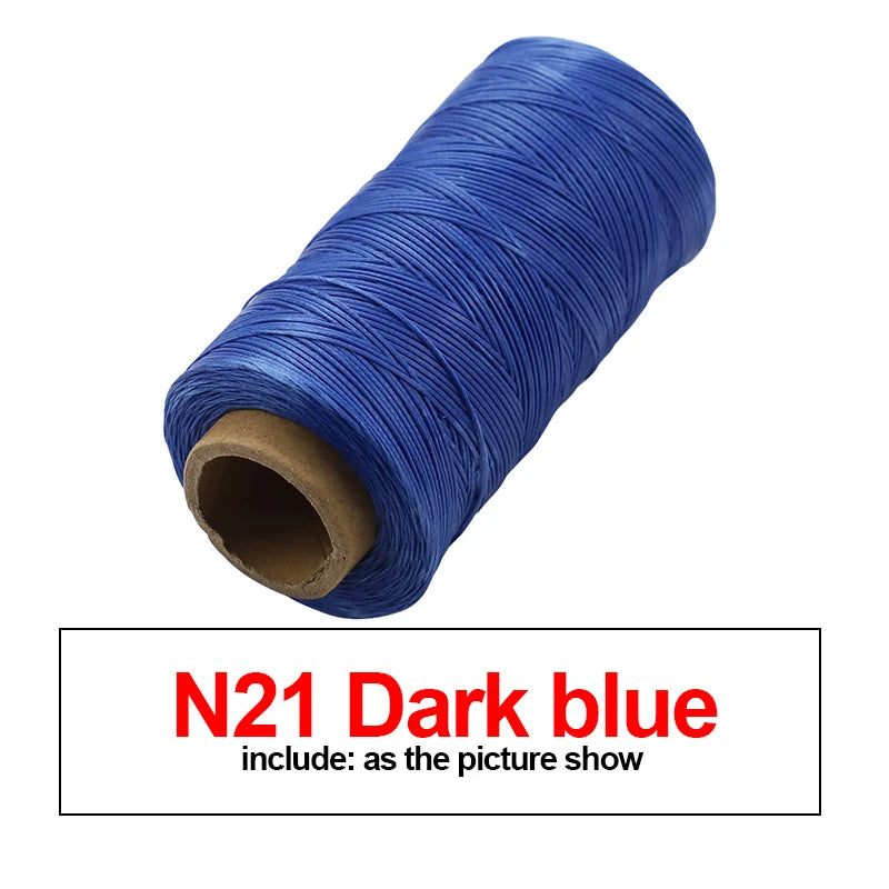 A spool of dark blue waxed thread for leather and crafting.