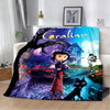 An animated print blanket featuring the character Coraline in a dark, magical setting with a house and trees.