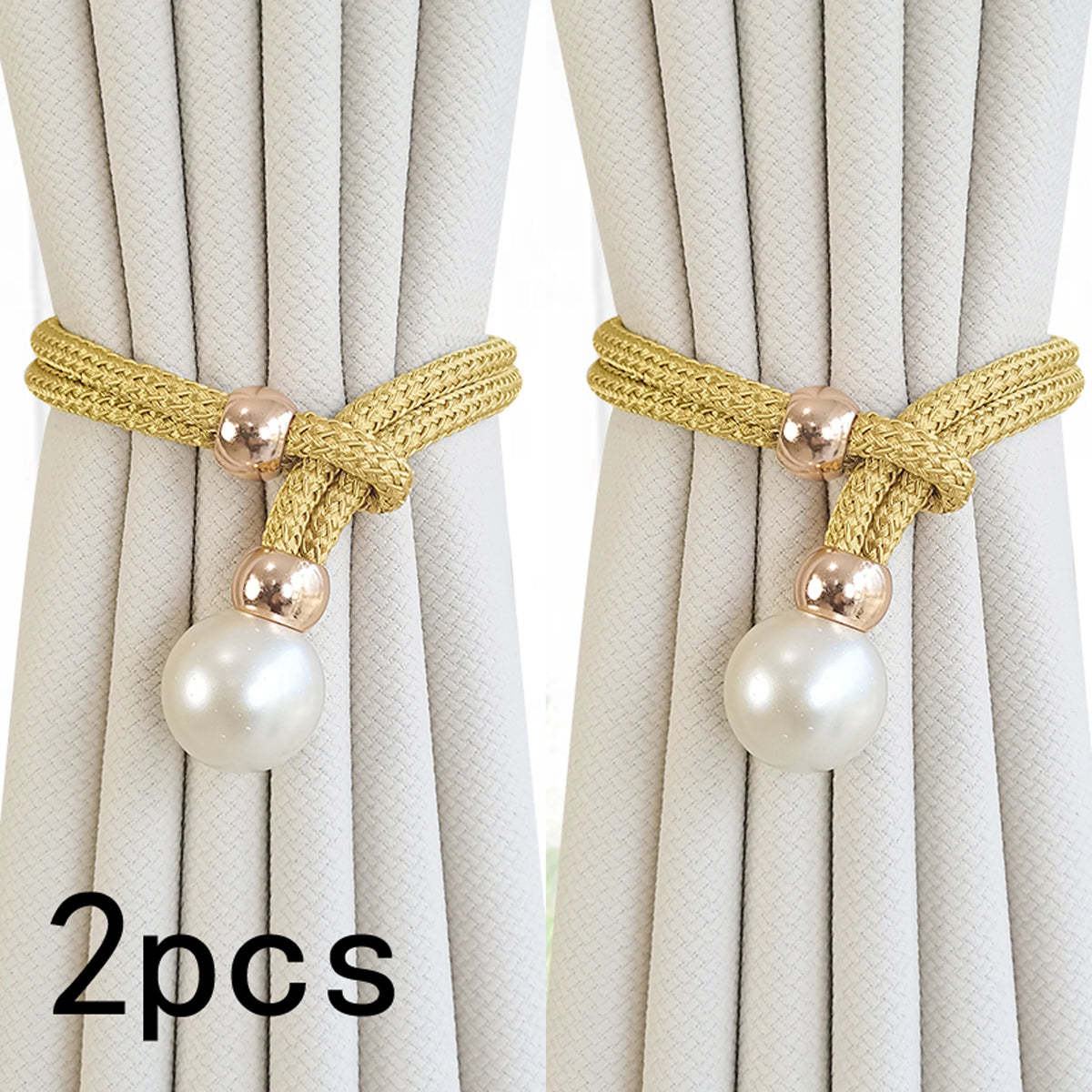 Two sets of gold woven artificial pearl curtain tie-backs against a light beige fabric backdrop
