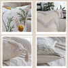 Close-up of a cream cushion cover with delicate green embroidery and fluffy beige trim.