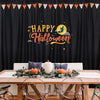 A black curtain panel decorated with a happy Halloween banner featuring yellow text and stars.
