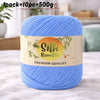 A skein of light blue silk bamboo blend yarn is shown on a white surface.