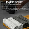 Rolls of gray lint-free microfiber cleaning towels displayed on a wooden tray.