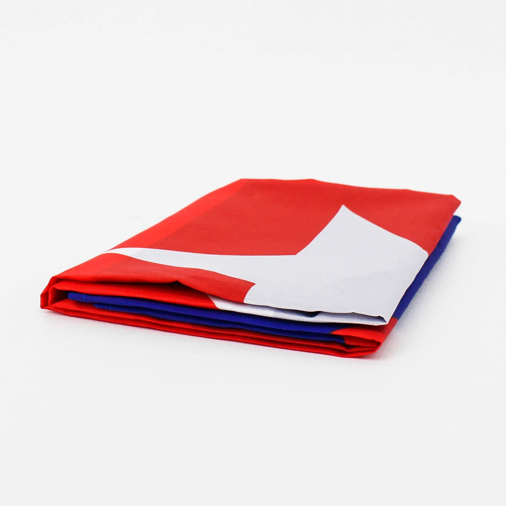 A stack of folded customizable Cuba flags in red, white, and blue.