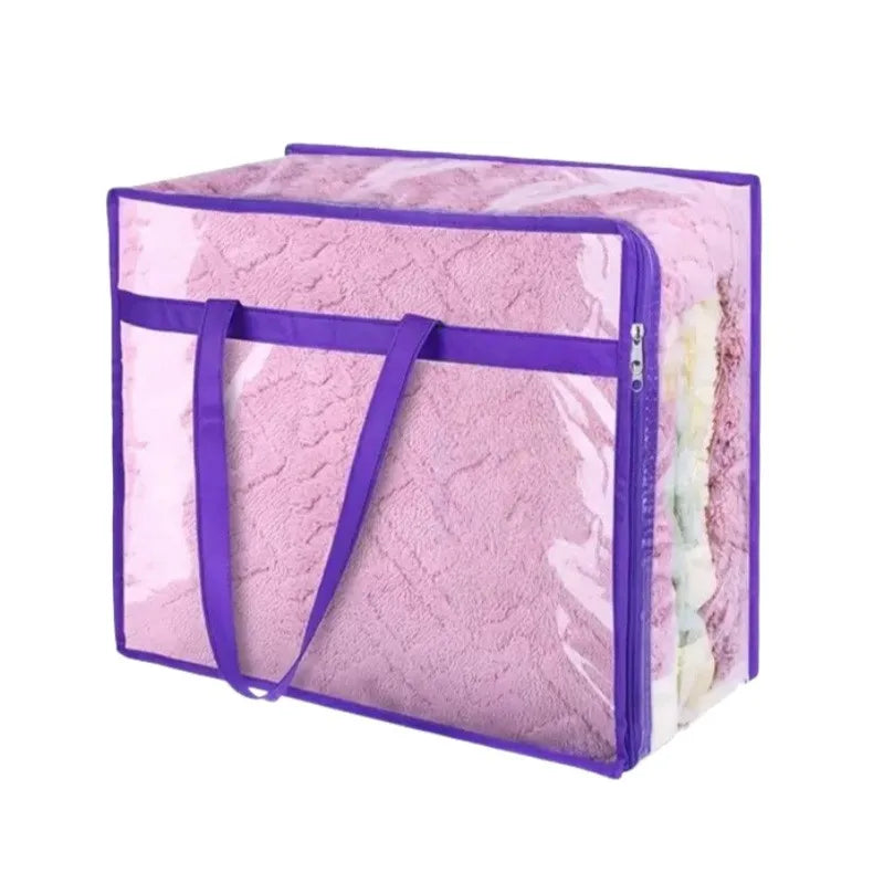Extra large multifunctional storage bag in pink fuzzy material with a purple zipper and strap.