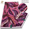 Pink and purple African wax print fabric featuring a detailed floral pattern.