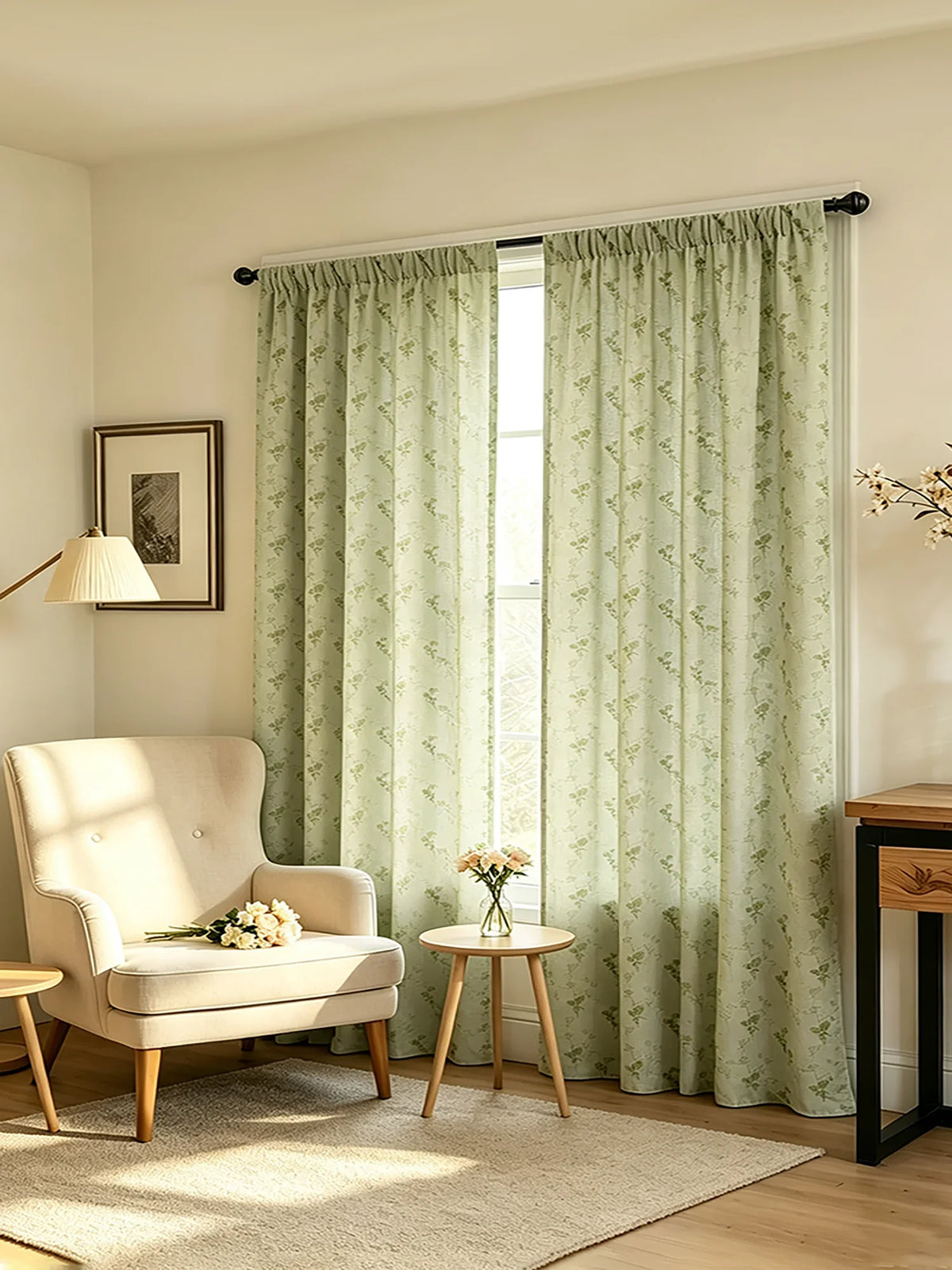 Sage green floral print curtains hanging in a window with natural light filtering through