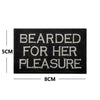 Black embroidered patch with white text reading Bearded for her pleasure and dimensions 5cm by 8cm