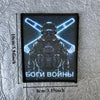 A black tactical skull patch hook and loop badge featuring a stylized helmet silhouette with glowing blue lines and the text 
