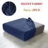 Navy velvet fabric sofa seat covers shown as a folded piece on a light wooden floor.