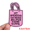 Pink letter embroidered iron-on patch shaped like a shopping bag with a handle