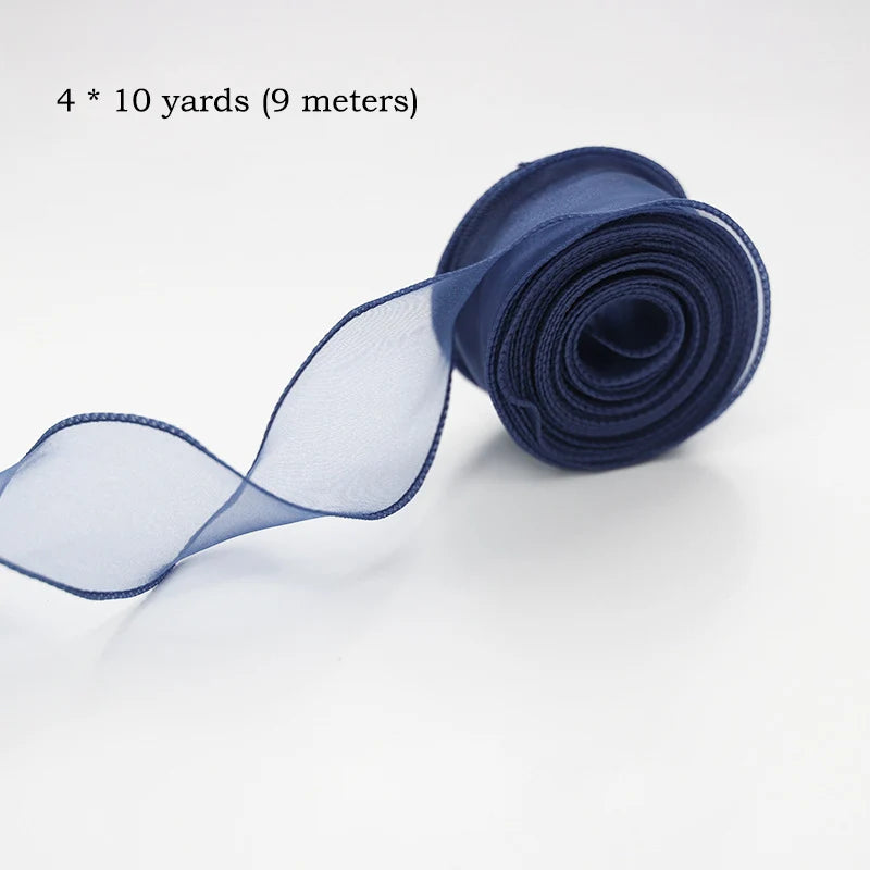 A roll of navy blue silky organza ribbon, measuring 4 x 10 yards (9 meters), shown unwound.