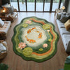 Round rug featuring an orange koi fish pattern surrounded by green and peach foliage on a wooden floor.