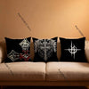 Black throw pillow covers featuring intricate gothic and cyber sigil designs on a beige sofa.