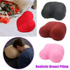 Realistic breast pillow in various colors including red, maroon, and pink, shown next to a person.