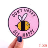 Pink embroidered patch with text Don't Worry Bee Happy