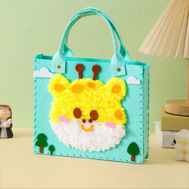 A felt craft kit featuring a yellow and white bear face with orange accents, set against a light green background.