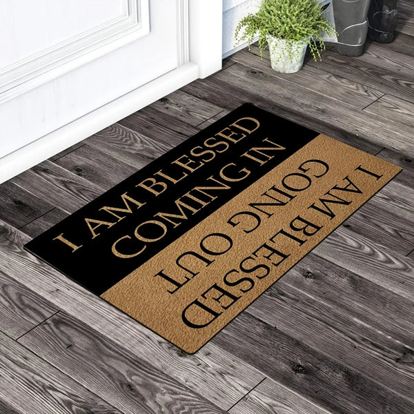 A black and gold doormat with the text I am blessed I am coming in I am blessed I am going out