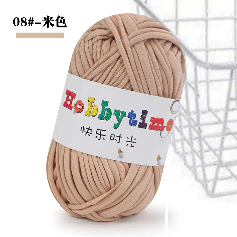 A ball of light beige craft yarn used for knitting and crochet projects.