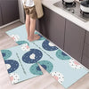 A set of two non-slip waterproof kitchen rugs with a diamond print featuring light blue and white polka dots.