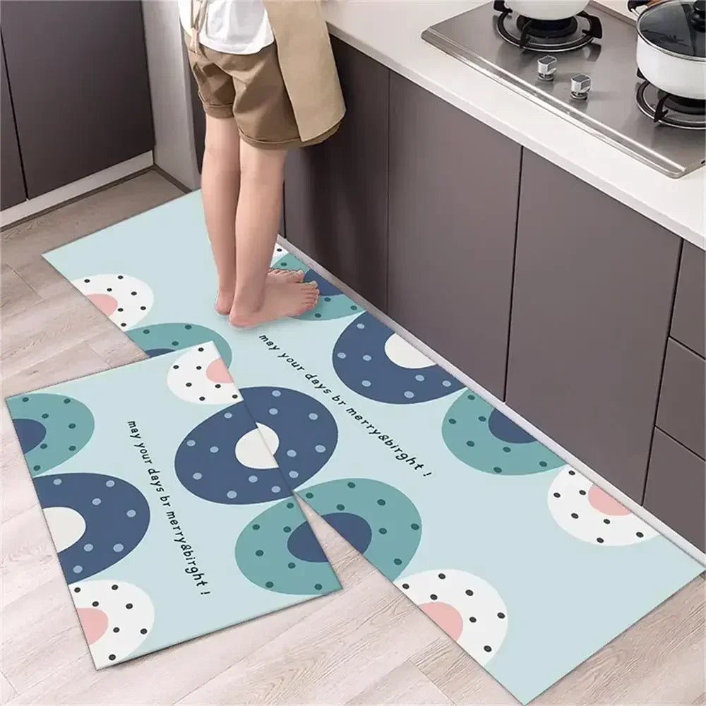 A set of two non-slip waterproof kitchen rugs with a diamond print featuring light blue and white polka dots.