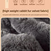 Close-up of dark gray rabbit fur velvet fabric showing soft texture and plush fibers.