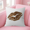 A white decorative pillow cover featuring a leopard print design on a pink sofa.