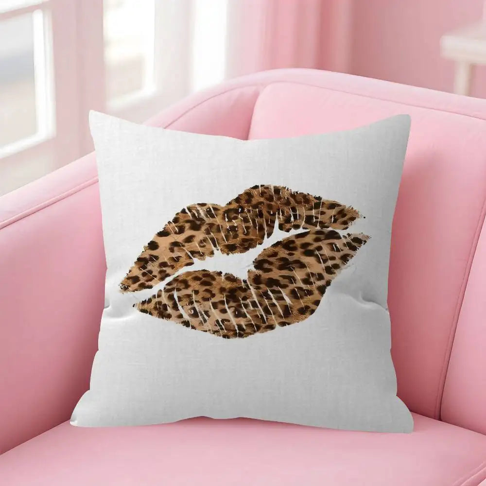 A white decorative pillow cover featuring a leopard print design on a pink sofa.
