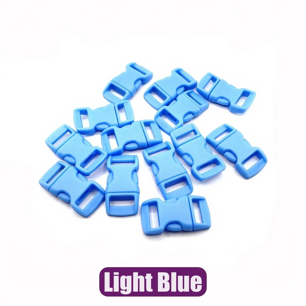 A pile of light blue adjustable plastic paracord buckle bracelets.