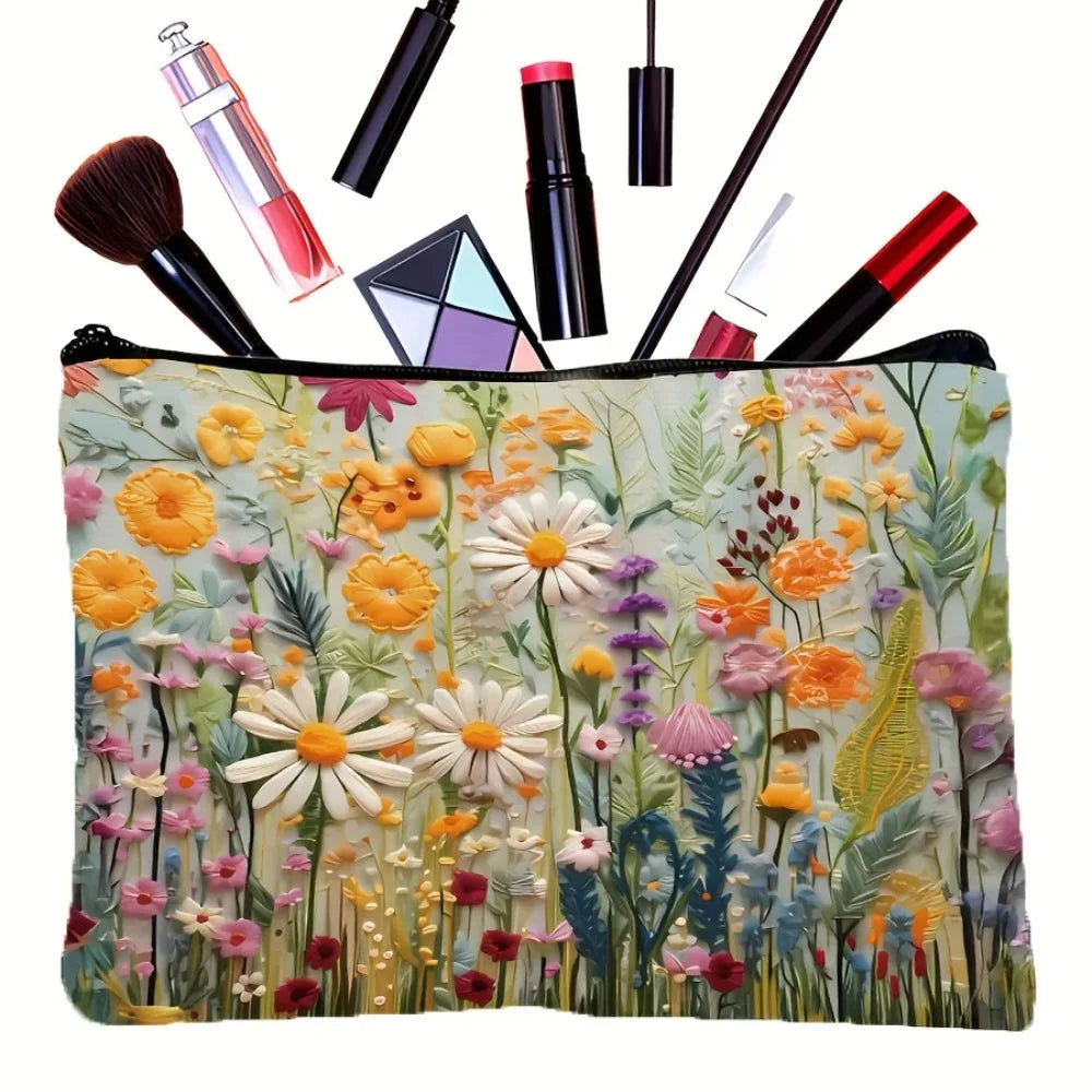Floral canvas cosmetic bag with zipper closure featuring a vibrant mix of yellow, pink, and green flowers.