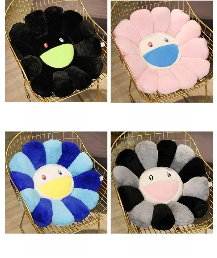 Four variations of a cozy sunflower plush cushion with a smile face in black, pink, and blue colors.