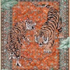 An orange and teal rug featuring a stylized tiger pattern with two tigers facing each other.