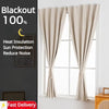 Light beige blackout curtains hanging on a window with a dark gray wall background.