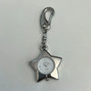 Silver star-shaped pocket watch keychain with a silver chain and adjustable clock face