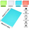 A collection of colored reusable EVA fridge shelf liners including green, white, blue, and red options.