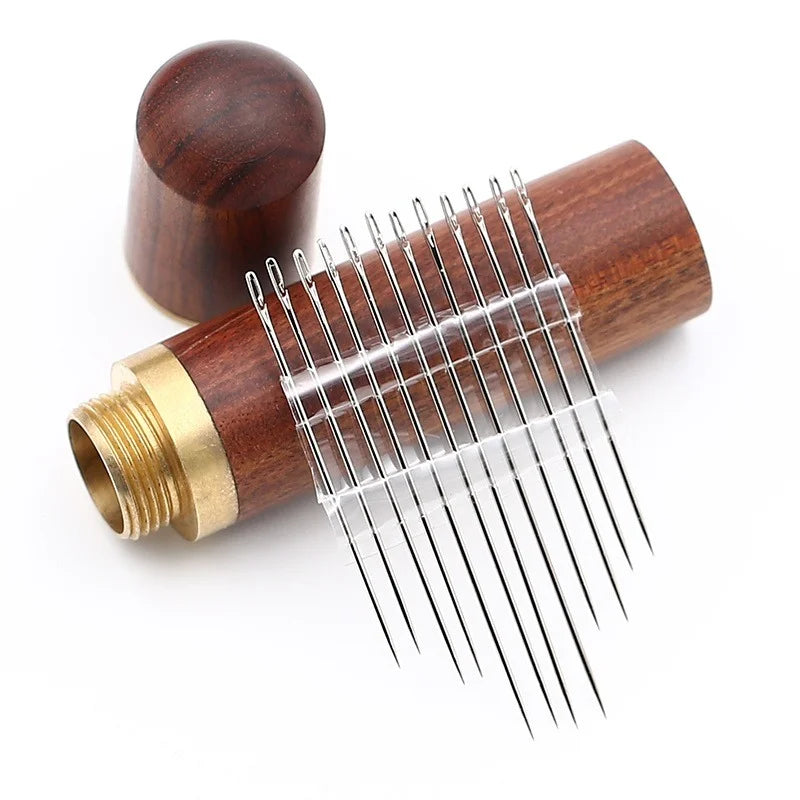 A set of stainless steel blind sewing needles with a wooden handle and brass ferrule.