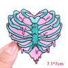 Pink and teal embroidered heart-shaped letter patches for clothing