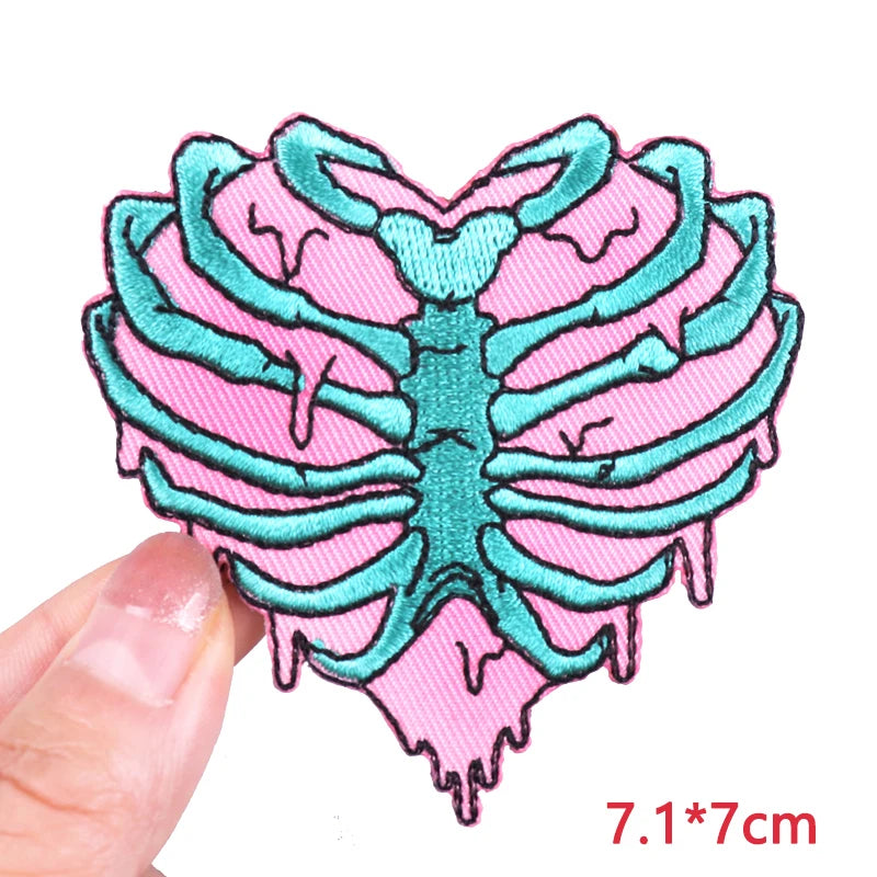 Pink and teal embroidered heart-shaped letter patches for clothing
