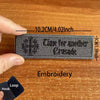 A dark gray embroidered patch with the text Time for another Crusade is shown next to a hand and a hook.
