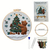 Embroidery DIY Art Kit featuring a Christmas tree, bear, and winter scene on a canvas with thread and needle.