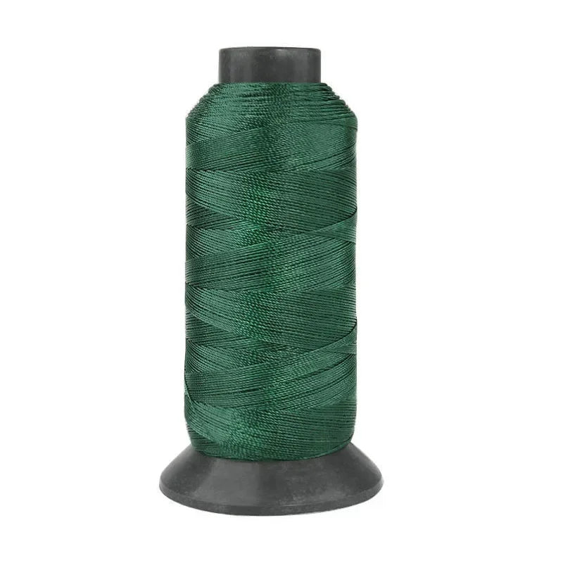 A roll of heavy duty 3-ply nylon sewing thread in dark green.