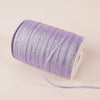 A roll of 10-meter gold and silver glitter satin ribbon is shown on a light background.
