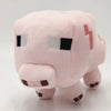 A soft pink stuffed dragon plush toy with black eyes and subtle orange accents.